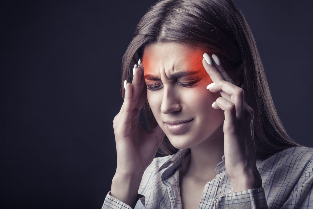 woman experiencing a migraine