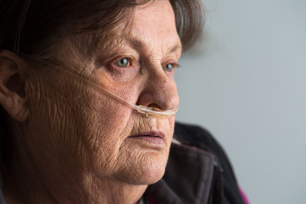 woman on oxygen delivered with a nasal cannula