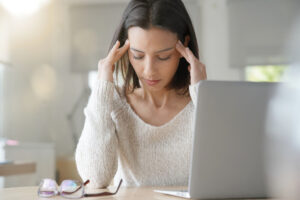 woman at work with a tension headache