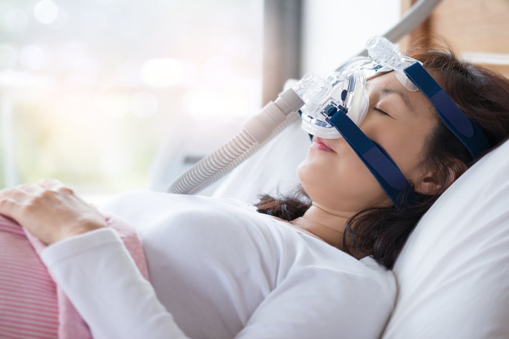 woman wearing a CPAP mask