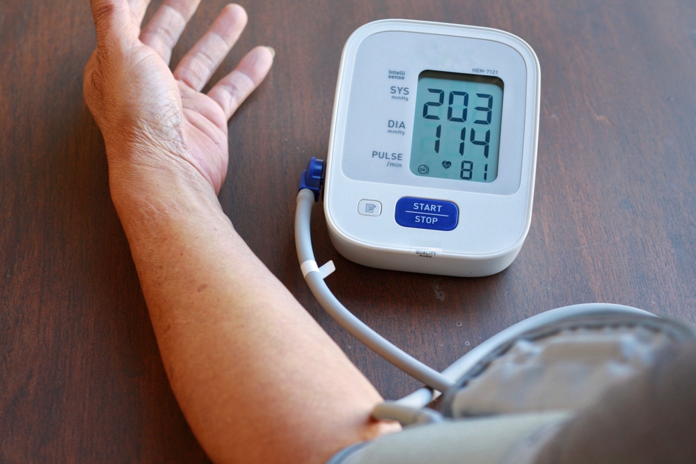 Patient with high blood pressure using a home testing device for monitoring