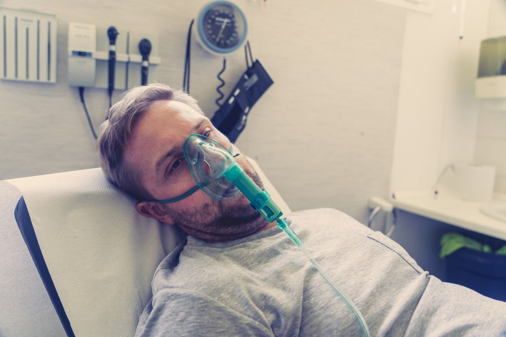 man receiving wall oxygen in a hospital