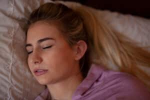 woman grinding her teeth while asleep