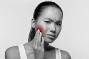 woman with sore jaw
